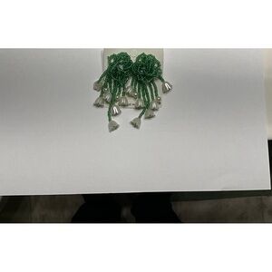 Attention-getting beaded green earrings with Lilly of the Valley flowers.